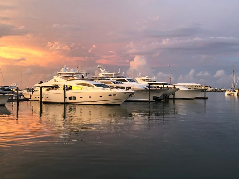 Sunset with white boats calm water