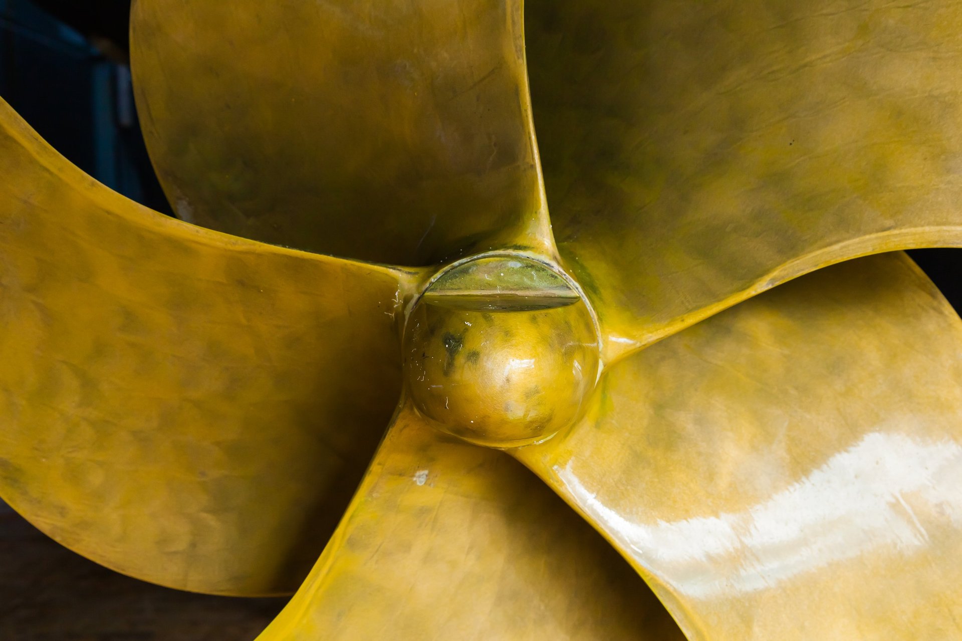A new bronze five-bladed propeller is installed on the ship, close-up